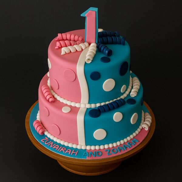 pink and blue twins birthday cake