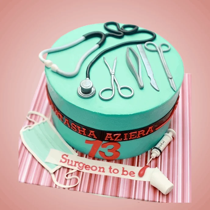 Teal cake with surgical tools for a surgeon to be
