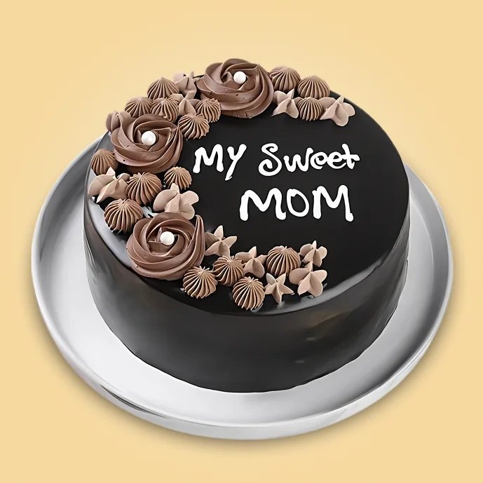 Chocolate Mother’s Day cake with “My Sweet Mom” message and decorative cream flowers