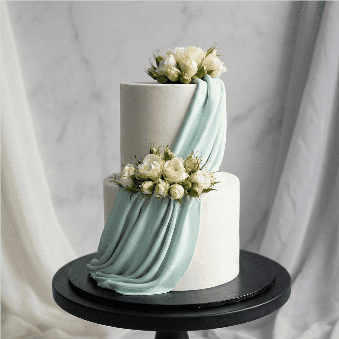 two tier drape floral wedding cake