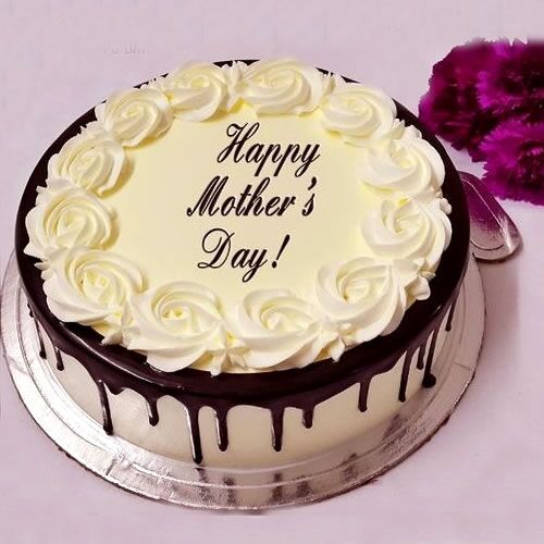 Mother’s Day cake with chocolate drip and white rose frosting topped with “Happy Mother’s Day” message.