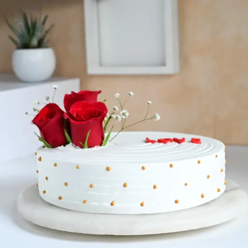 beautiful white cake with red roses