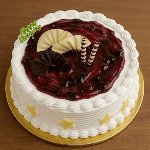 White cake with blueberry topping and chocolate decor