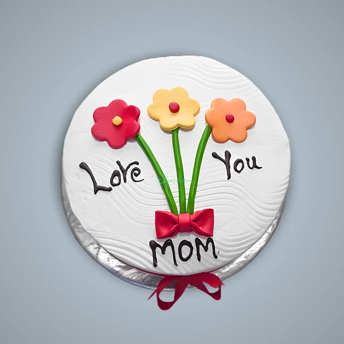 Mother’s Day cake with colorful flower design and “Love You Mom” message on white frosting