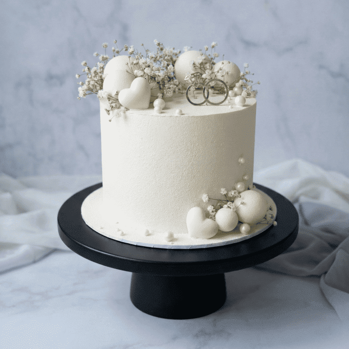 white elegant anniversary cake
