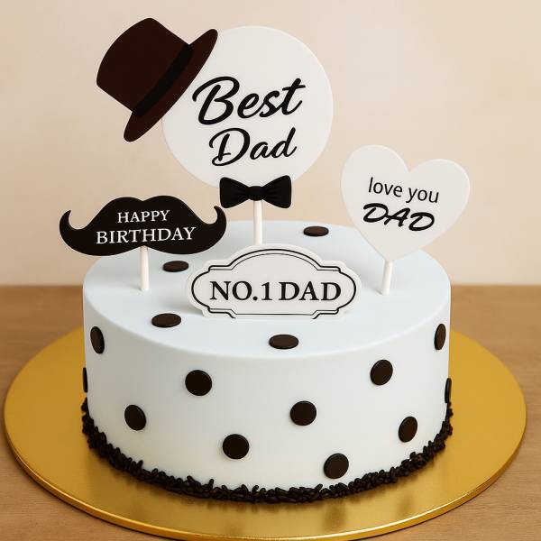 White cake with black dots and “No.1 Dad” toppers