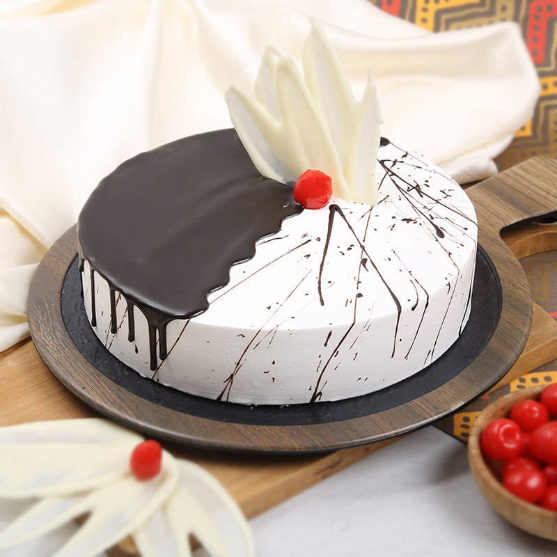 delectable choco vanilla cake cherry on the top