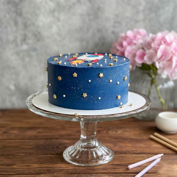 galaxy rocket cake with gold stars side view