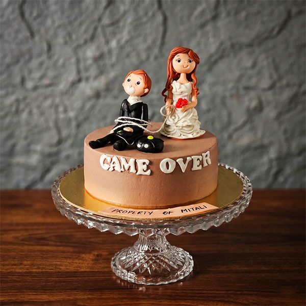game over cake with couple topper