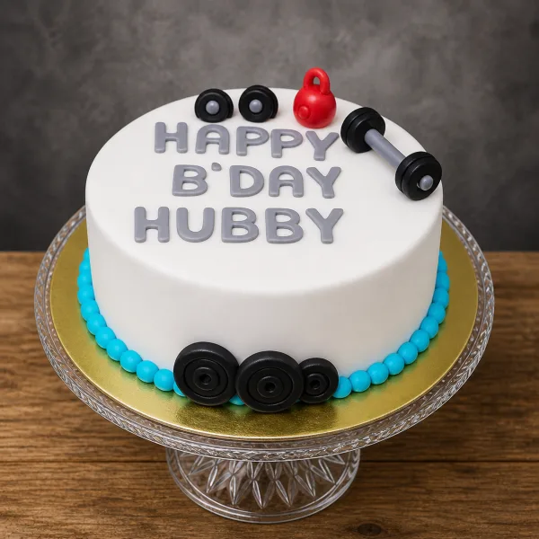 White fitness cake with blue beaded border, fondant weights, and Happy B'day Hubby text.