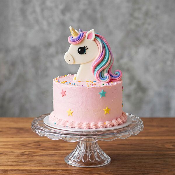 pink unicorn star head topper cake