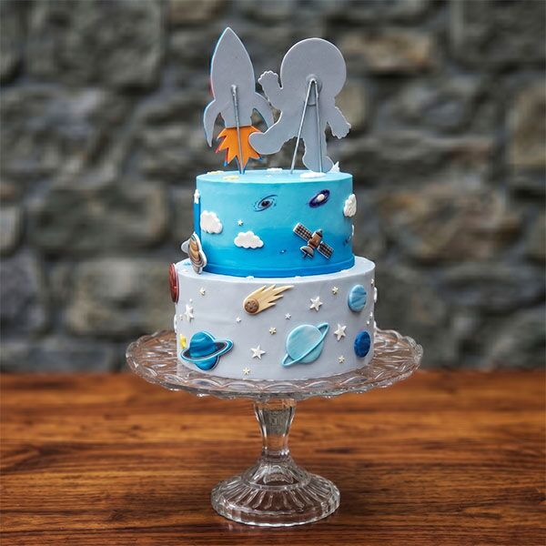 two-tier cartoon astronaut cake back view