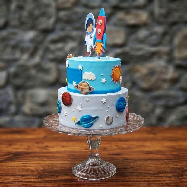 two-tier cartoon astronaut cake side view