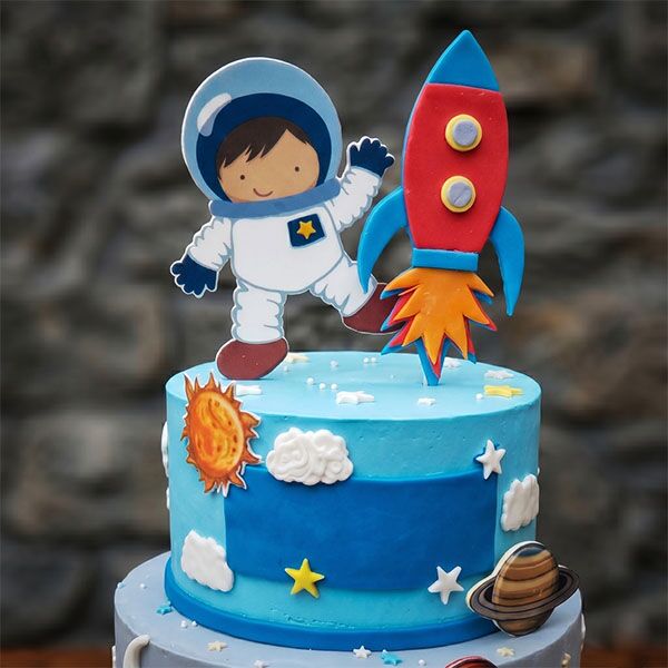 two-tier cartoon astronaut cake top view