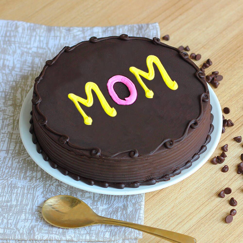Mother’s Day chocolate cake with “MOM” written in colorful icing