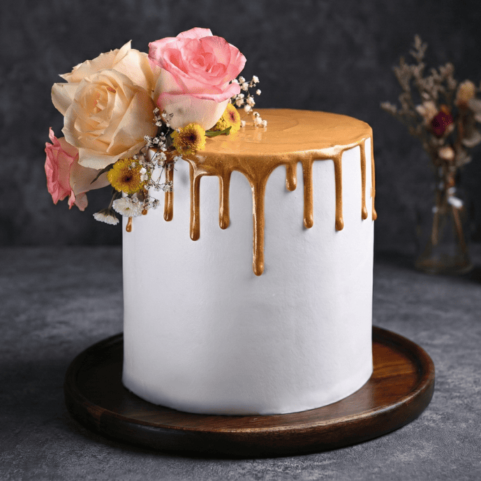 gold drip floral wedding cake