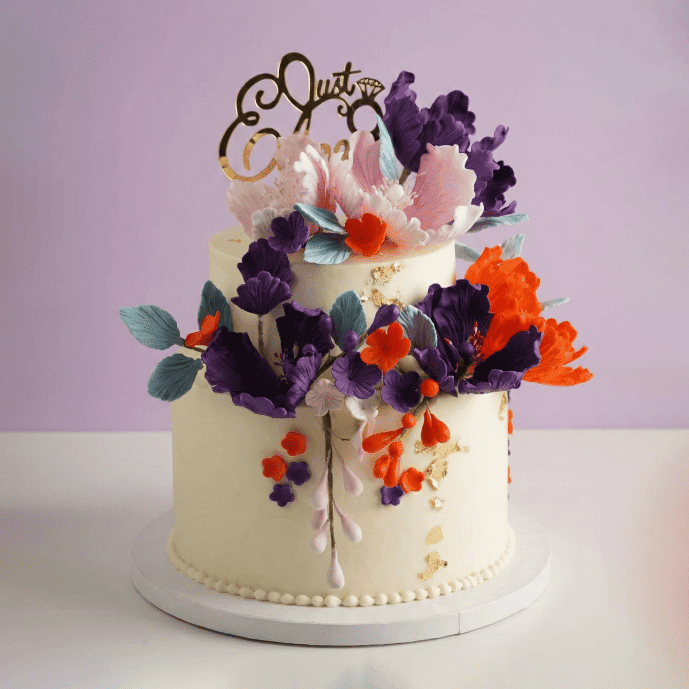 2 tier colorful floral engagement cake