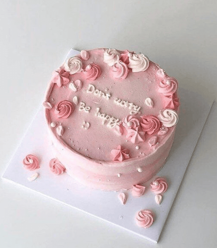 beautiful pink cake with cream flowers