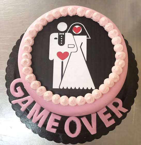 Bachelorette-themed cake with a photo of the bride and groom