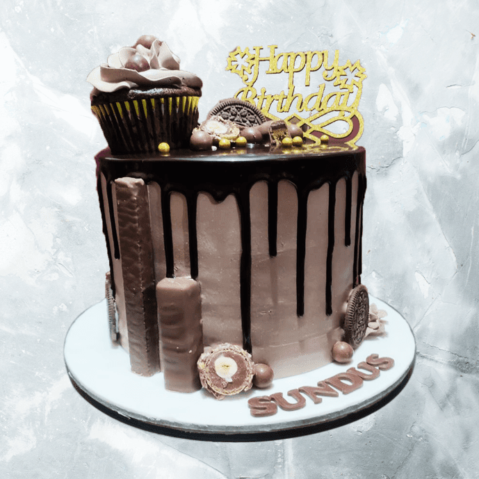 chocolate drip cake with cupcake
