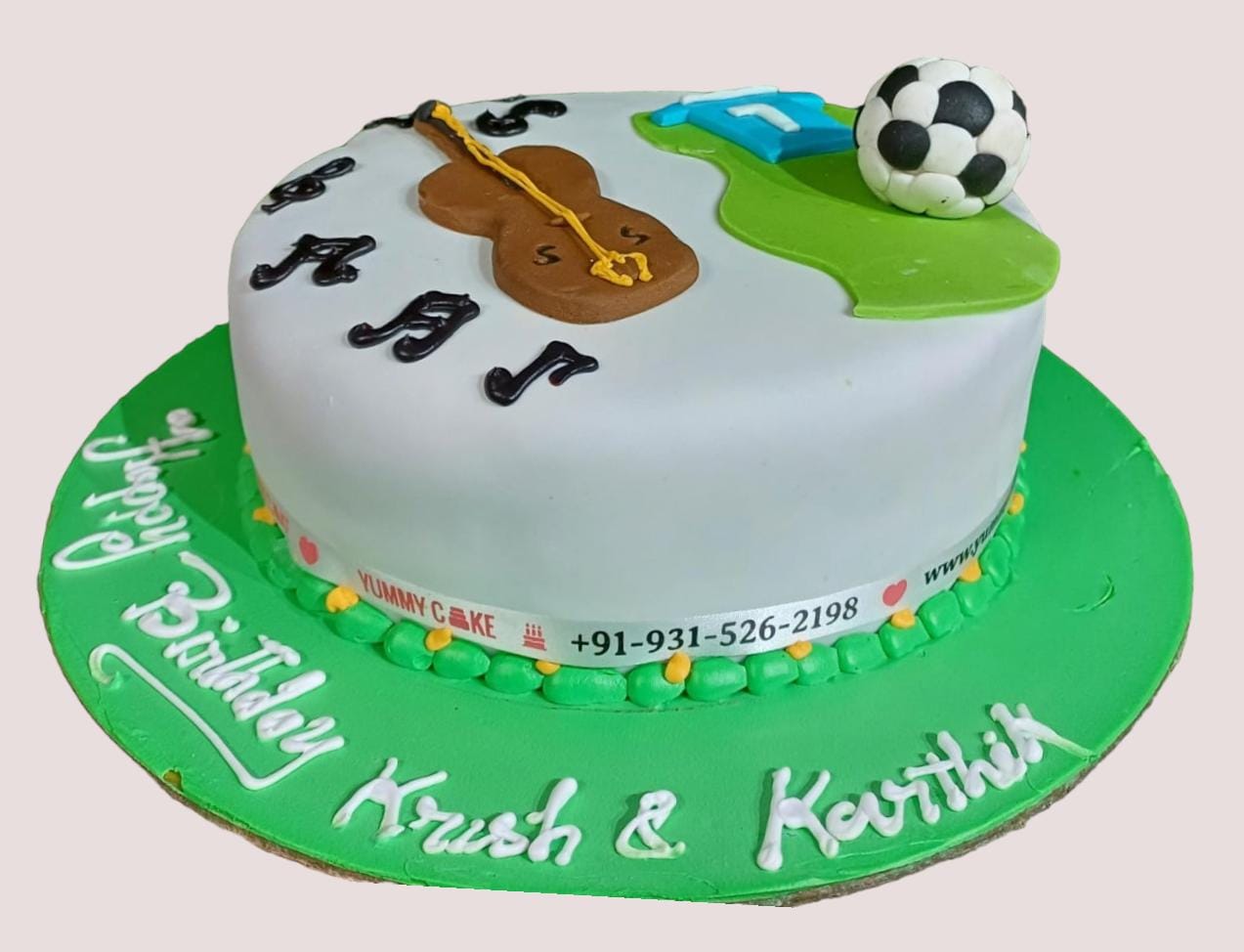 football and guitar theme cake